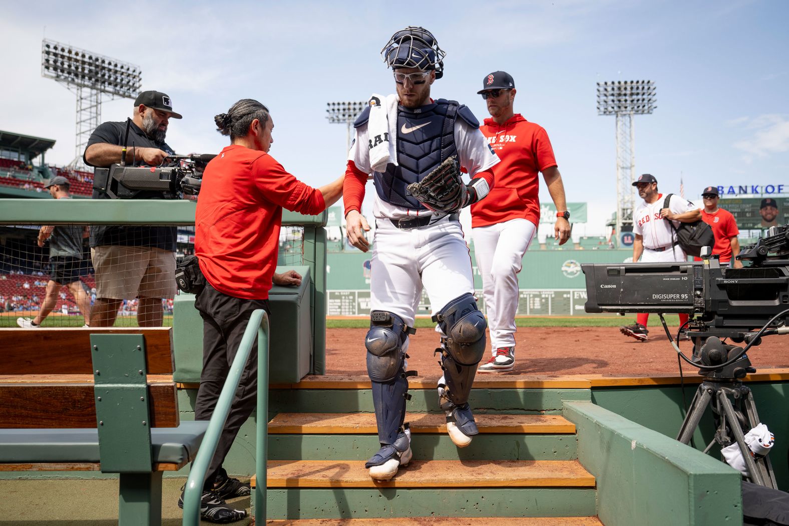 Boston Red Sox catcher Danny Jansen walks into the dugout before a doubleheader against Toronto on Monday, August 26. Jansen would soon make Major League Baseball history <a >by becoming the first player to play for two teams in the same game</a>. The two teams were resuming a weather-suspended game from June, when Jansen was in the middle of an at-bat for Toronto.