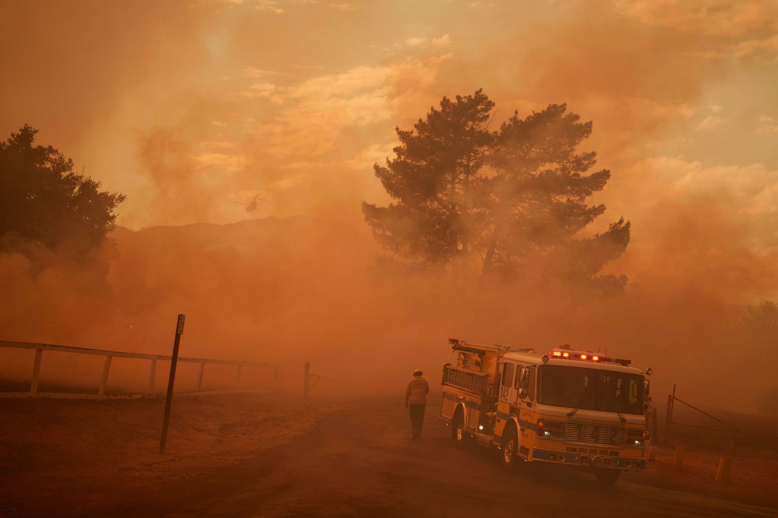 Firefighters work against the advancing Felicia Fire in Piru, California, on Thursday, October 3.