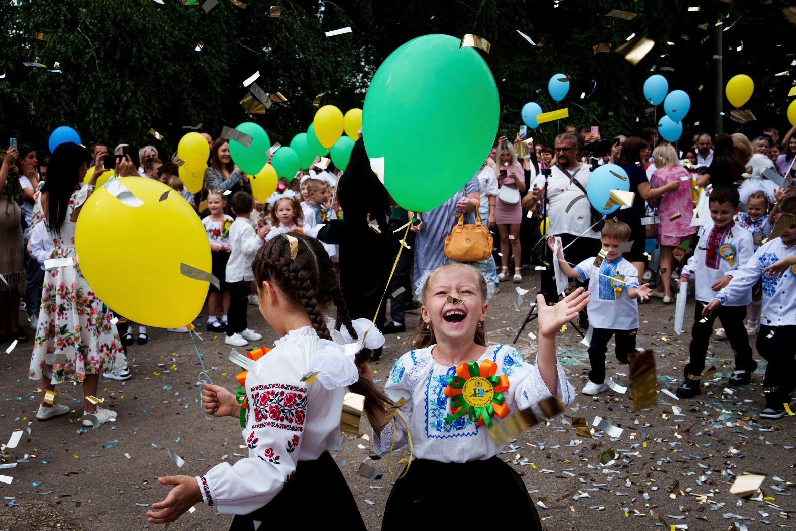 First-graders attend a ceremony celebrating the first day of school in Zaporizhzhia, Ukraine, on Sunday, September 1.