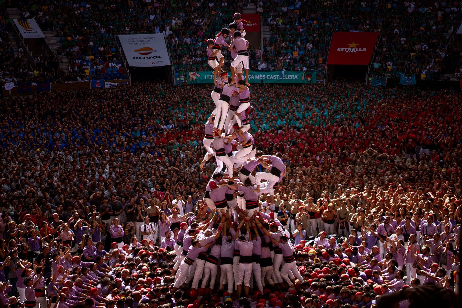 Members of the group Colla Jove de Tarragona fall before completing a “castell,” or human tower, during the annual Human Tower Competition in Tarragona, Spain, on Sunday, October 6.