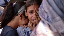 TOPSHOT - Children react following an Israeli strike on a school sheltering displaced Palestinians in Falluja near the Jabalia refugee camp in the norther Gaza Strip on September 26, 2024, amid the ongoing war between Israel and the Hamas militant group. (Photo by Omar AL-QATTAA / AFP) (Photo by OMAR AL-QATTAA/AFP via Getty Images)