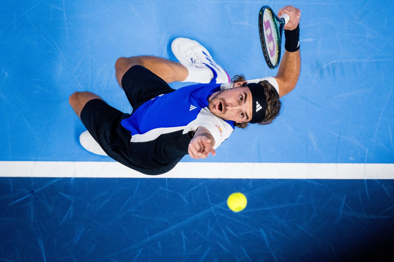 Tennis pro Stefanos Tsitsipas serves to Jiri Lehecka during their quarterfinal match at the European Open in Antwerp, Belgium, on Friday, October 18.