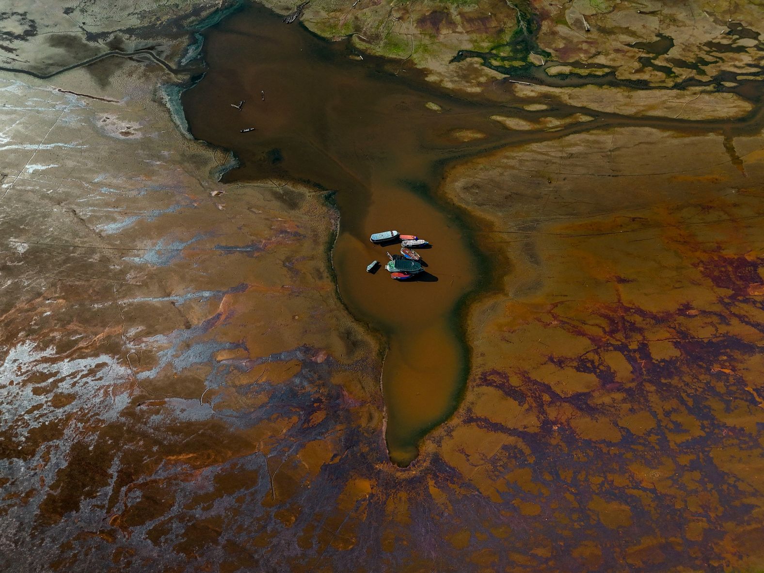 Boats are seen stranded on Aleixo Lake due to the severe drought in Manaus, Brazil, on Friday, September 20.