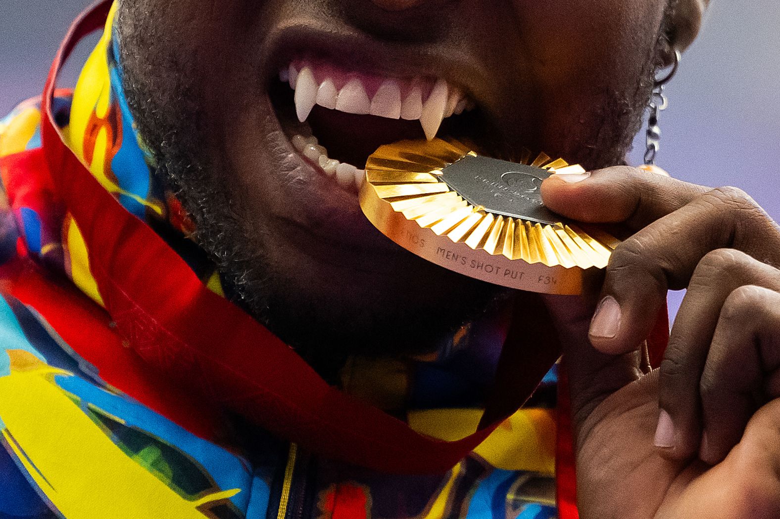 Colombian athlete Mauricio Valencia sinks his teeth into his gold medal after winning a shot put event at the Paris Paralympics on Saturday, September 7. <a target="_blank">Valencia had his teeth modified to mimic fangs</a>, he said, in at attempt to change the stigma toward Paralympic athletes. "I didn't want to have the same smile as the rest of the world," Valencia said in 2019. "I've always said that Paralympic sport has to be a show. That means being outside of the stereotype of sitting in a wheelchair. It's a matter of attitude in life, and while I am competing."
