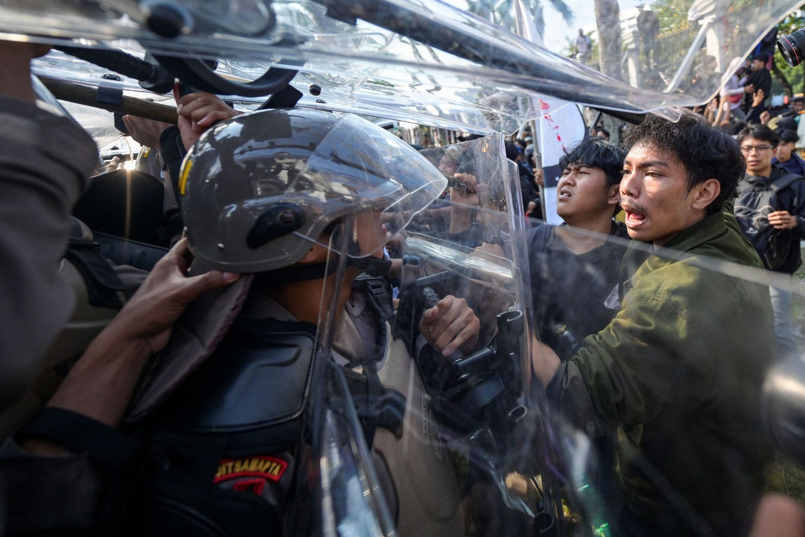 Police and demonstrators clash outside the parliament building in Jakarta, Indonesia, on Thursday, August 22. Amid widespread outcry, Indonesia’s legislature <a >will not ratify changes to election rules</a> during the current government’s term, its deputy speaker said Thursday.