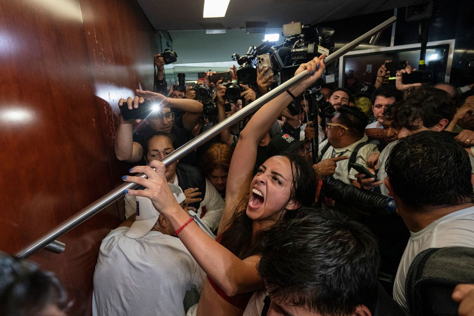 Protesters try to break into a room in the Mexican Senate as lawmakers weighed a controversial judicial reform in Mexico City on Tuesday, September 10. Protesters broke into the Senate chamber and forced a suspension of the proceedings, but hours later <a >the Senate narrowly passed the reform</a>, under which Mexicans would elect judges at all levels of government by a popular vote.