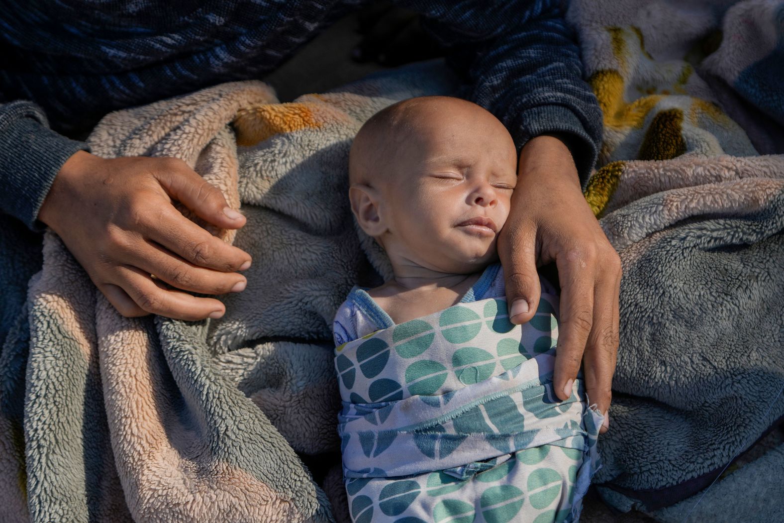 A woman cares for her newborn daughter, Fatima, in Beirut's Martyrs' Square after fleeing Israeli airstrikes in the southern suburbs of Dahiyeh on Sunday, September 29. An eerie calm fell over the Lebanese capital hours after <a href="index.php?page=&url=https%3A%2F%2Fwww.cnn.com%2F2024%2F09%2F29%2Fmiddleeast%2Fisrael-lebanon-war-devastation-beirut-intl-latam%2Findex.html">Israeli warplanes pummeled its southern suburbs</a>, Hezbollah’s seat of power where hundreds of thousands of civilians live.