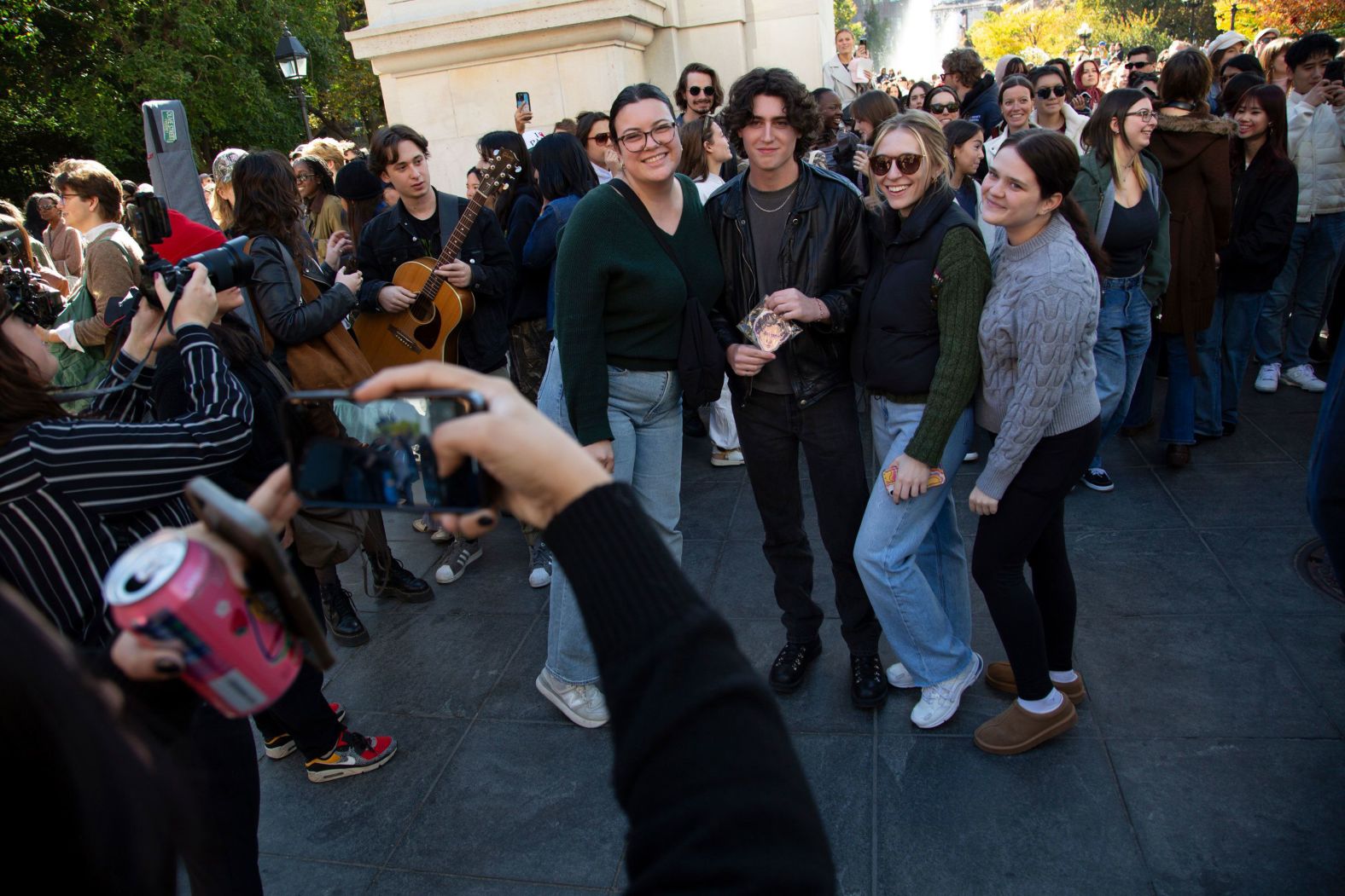 Reed Putnam, who entered a Timothée Chalamet lookalike contest in New York and <a href="index.php?page=&url=https%3A%2F%2Fwww.cnn.com%2F2024%2F10%2F28%2Fstyle%2Ftimothee-chalamet-lookalike-competition%2Findex.html">wrote about it for CNN</a>, poses with onlookers at Washington Square Park on Sunday, October 27. The actor himself even made a <a href="index.php?page=&url=https%3A%2F%2Fwww.cnn.com%2Ftimothee-chalamet-lookalike-contest-ldn-digvid">surprise appearance</a> at the event.