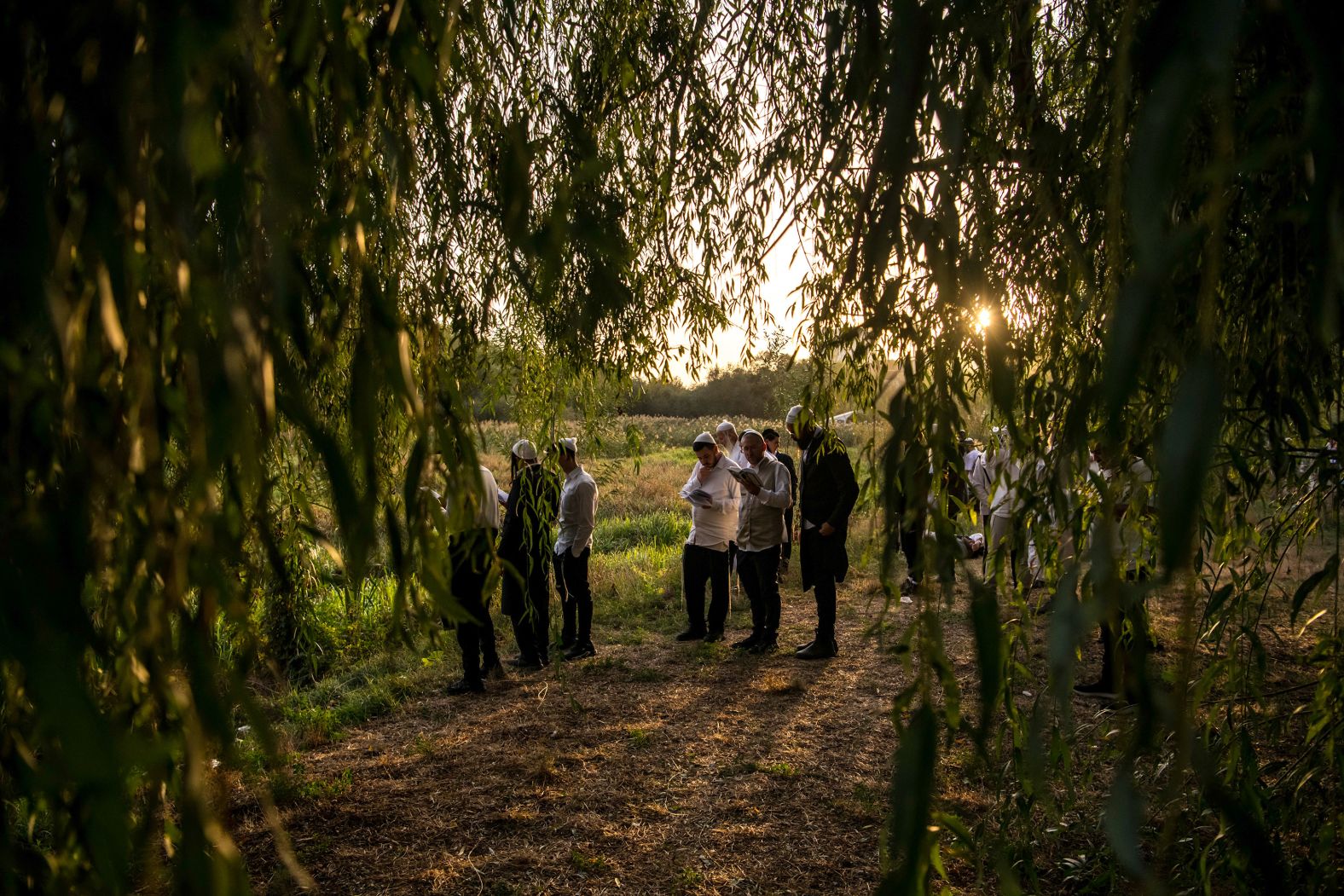 Ultra-Orthodox Jewish pilgrims pray on the bank of a lake in Uman, Ukraine, near the tomb of Rabbi Nachman, as they celebrate Rosh Hashanah, the Jewish New Year, on Thursday, October 3.