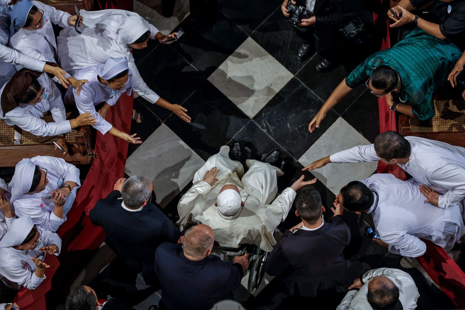 Pope Francis is greeted as he arrives at the Jakarta Cathedral in Indonesia on Wednesday, September 4. The pope embarked on a <a >marathon 12-day visit of four countries</a> this week, one of the longest foreign trips any pope has embarked on and the furthest geographical distance he has traveled since his 2013 election.