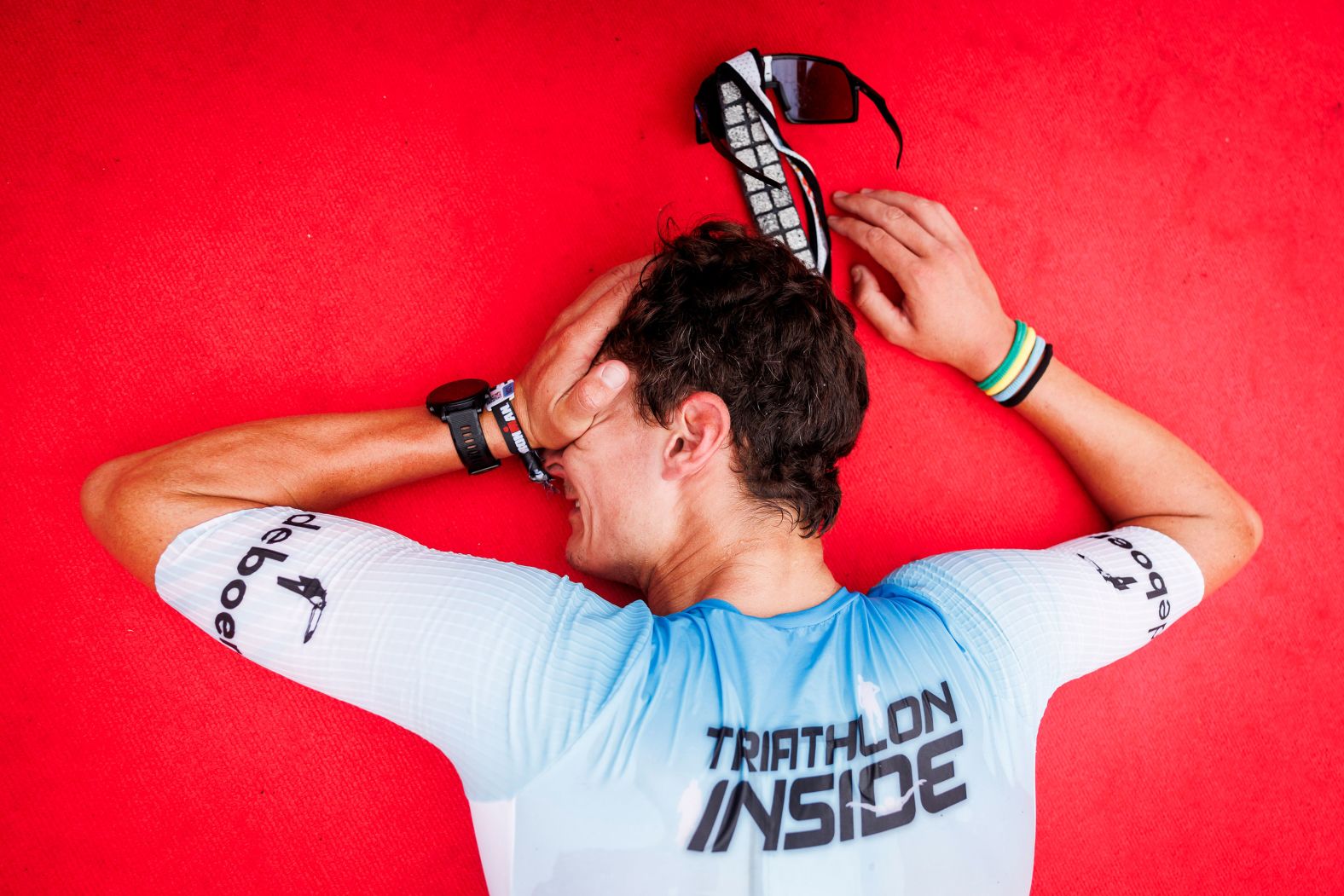 Dutch triathlete Menno Koolhaas reacts after crossing the finish line at the Ironman event in Frankfurt an der Oder, Germany, on Sunday, August 18. He finished in fifth place.