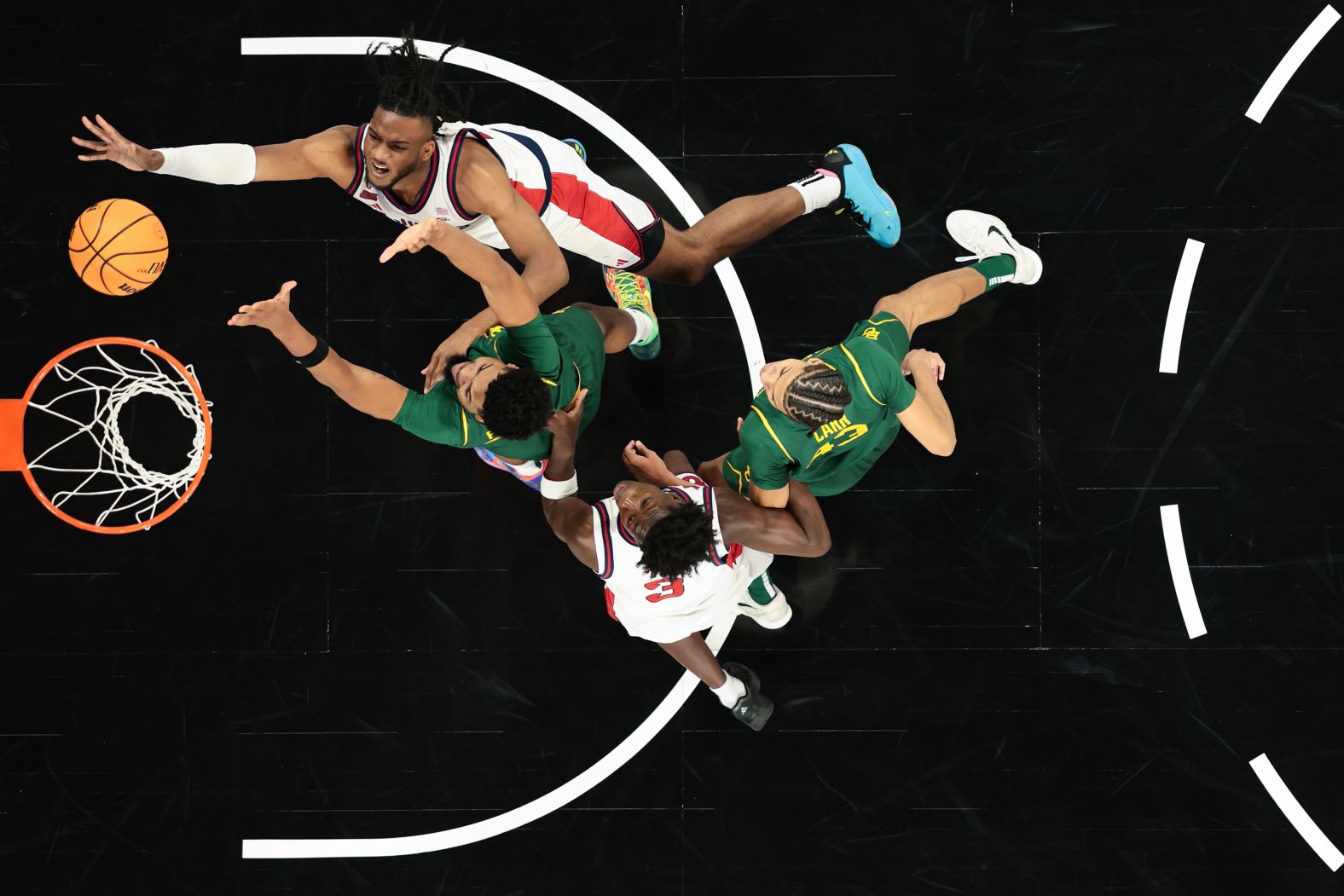 St. John’s forward Zuby Ejiofor, top, attempts a shot against Baylor during a college basketball game in Las Vegas on Tuesday, November 25.