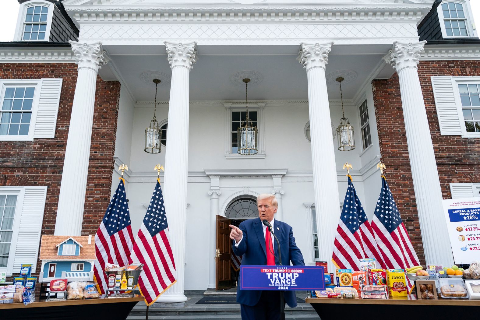 Former US President Donald Trump, the Republican Party’s presidential nominee, speaks during a <a >news conference</a> at the Trump National Golf Club in Bedminster, New Jersey, on Thursday, August 15. He had various goods on display as he talked about inflation.