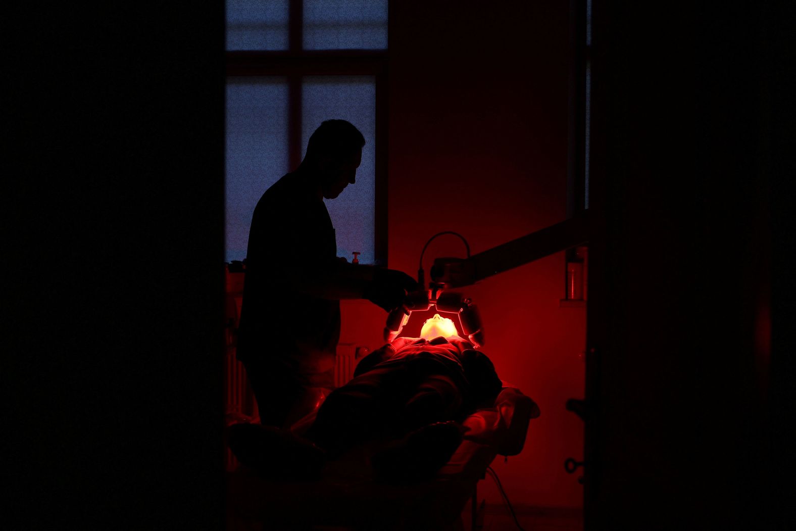 Yana Zalevska, a former Ukrainian service member who was wounded on the front lines of the war against Russia, has her scars treated in Lviv, Ukraine, on Friday, October 18.