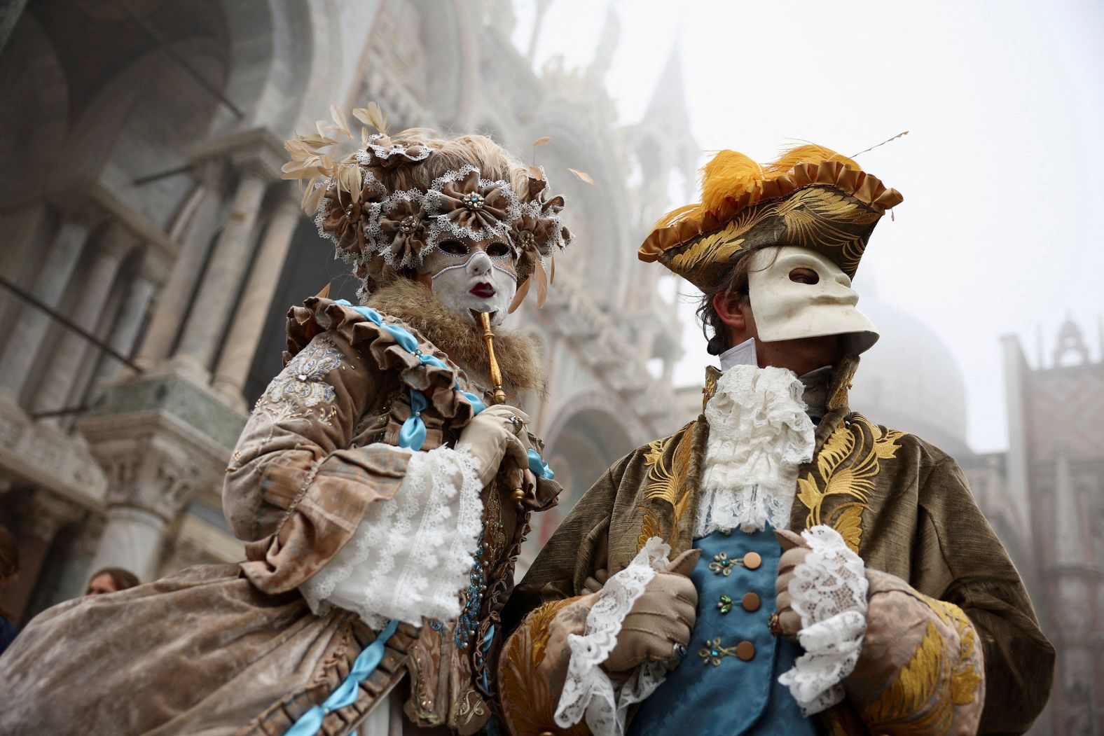 Masked revelers take part in a Carnival event in Venice, Italy, on Saturday, January 27.
