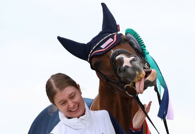 US Paralympian Fiona Howard celebrates with her horse Diamond Dunes after winning a gold medal in Versailles, France, on Saturday, September 7.