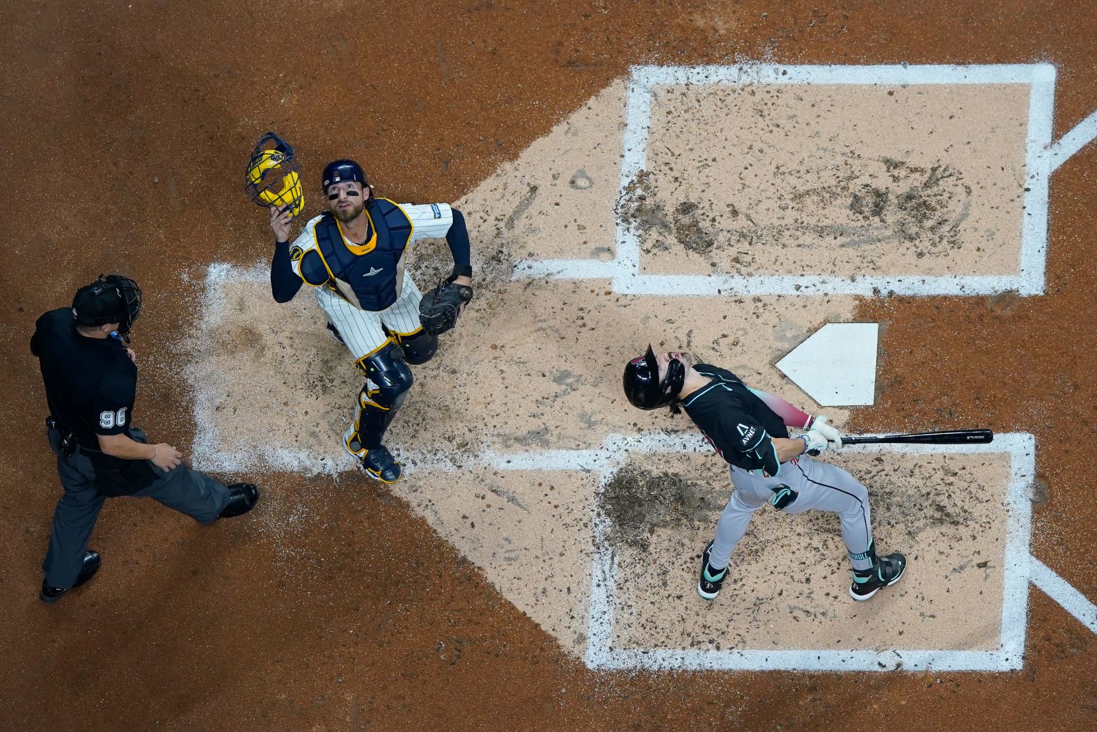 Arizona Diamondbacks' center fielder Corbin Carroll, right, and Milwaukee Brewers' catcher Eric Haase look up at a foul ball during the second inning of a baseball game in Milwaukee on Saturday, September 21.