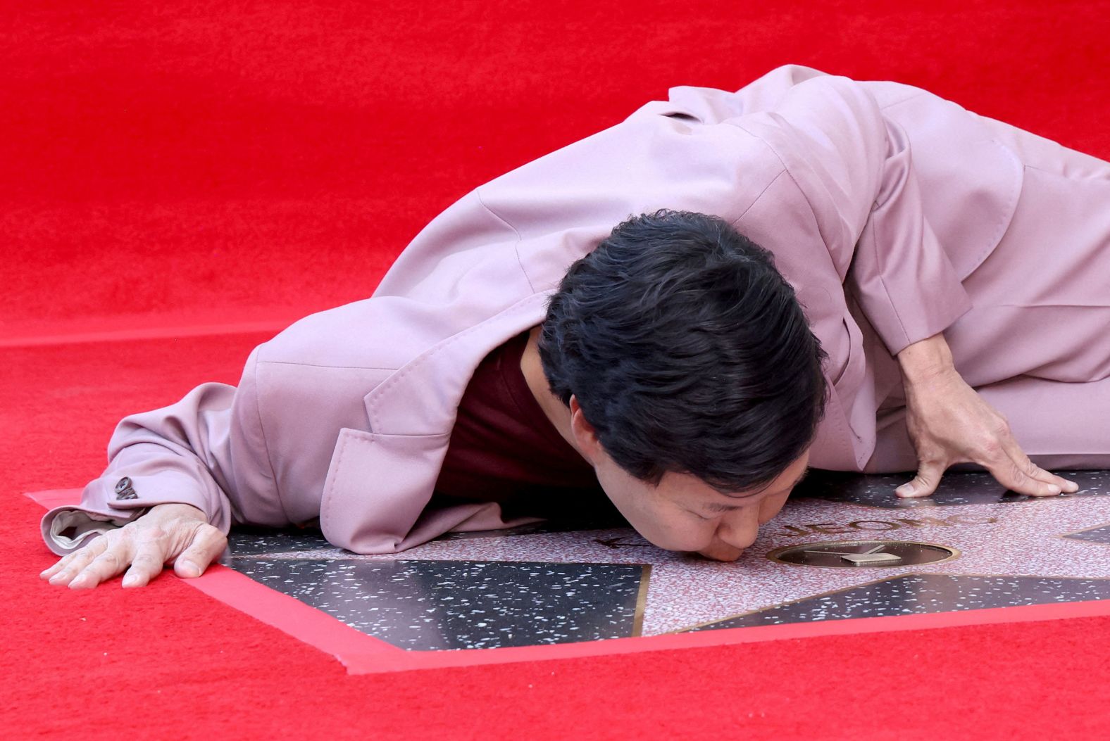 Actor Ken Jeong kisses his star as it is unveiled on the Hollywood Walk of Fame on Wednesday, October 23.