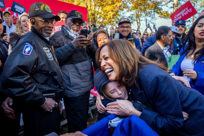 Harris hugs a child after speaking at a campaign event in Washington Crossing, Pennsylvania, on October 16.