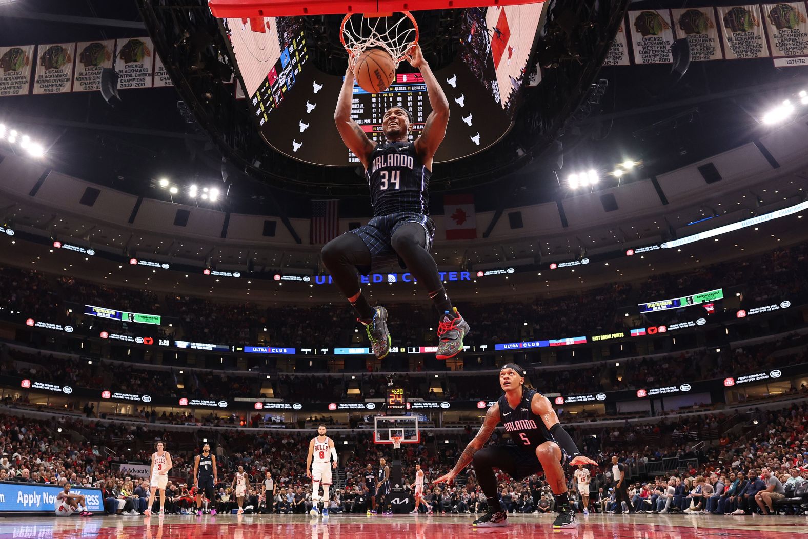 Orlando Magic center Wendell Carter Jr. dunks the ball next to teammate Paolo Banchero during an NBA game in Chicago on Wednesday, October 30.