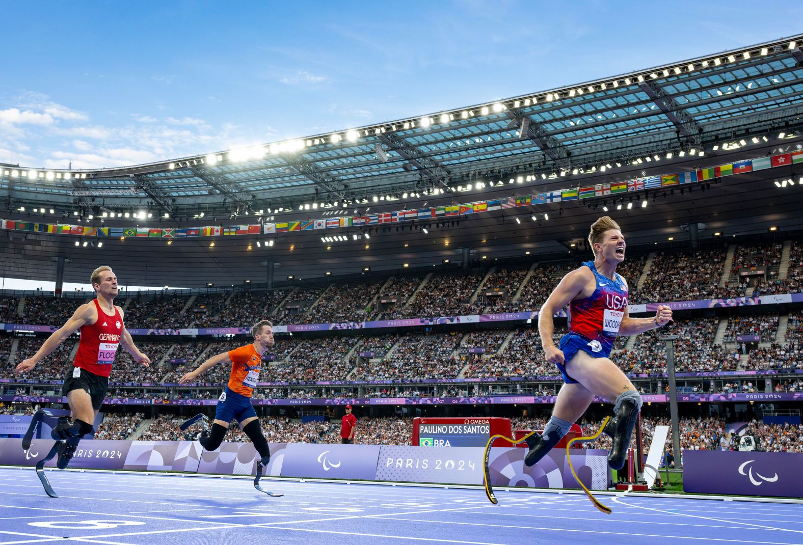 US athlete Hunter Woodhall celebrates after <a >winning a 400-meter final at the Paris Paralympics</a> on Friday, September 6. Woodhall’s wife, Tara Davis-Woodhall, won gold in the Olympic long jump last month.