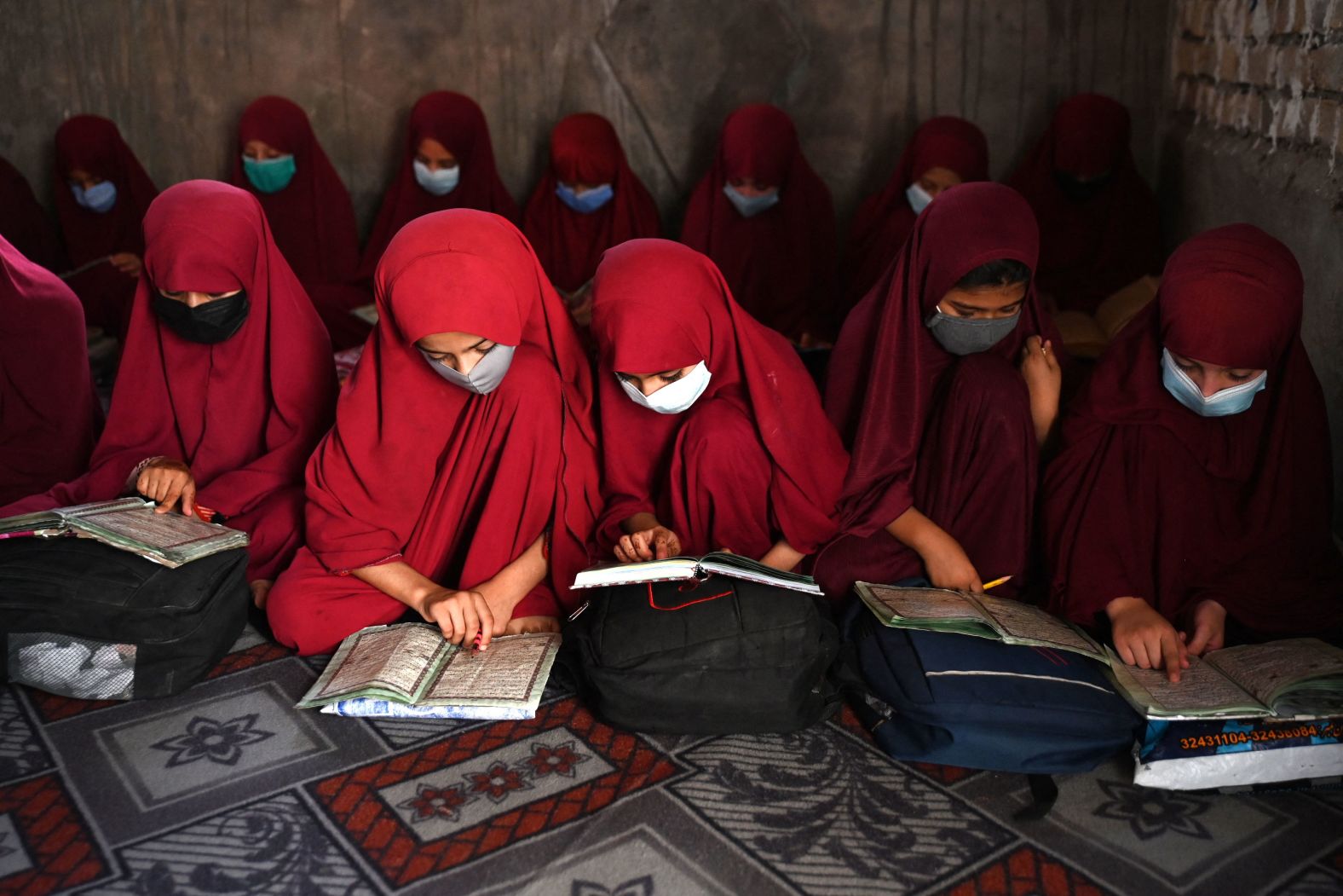 Girls read the Quran at an Islamic school in Kandahar, Afghanistan, on Wednesday, August 28.