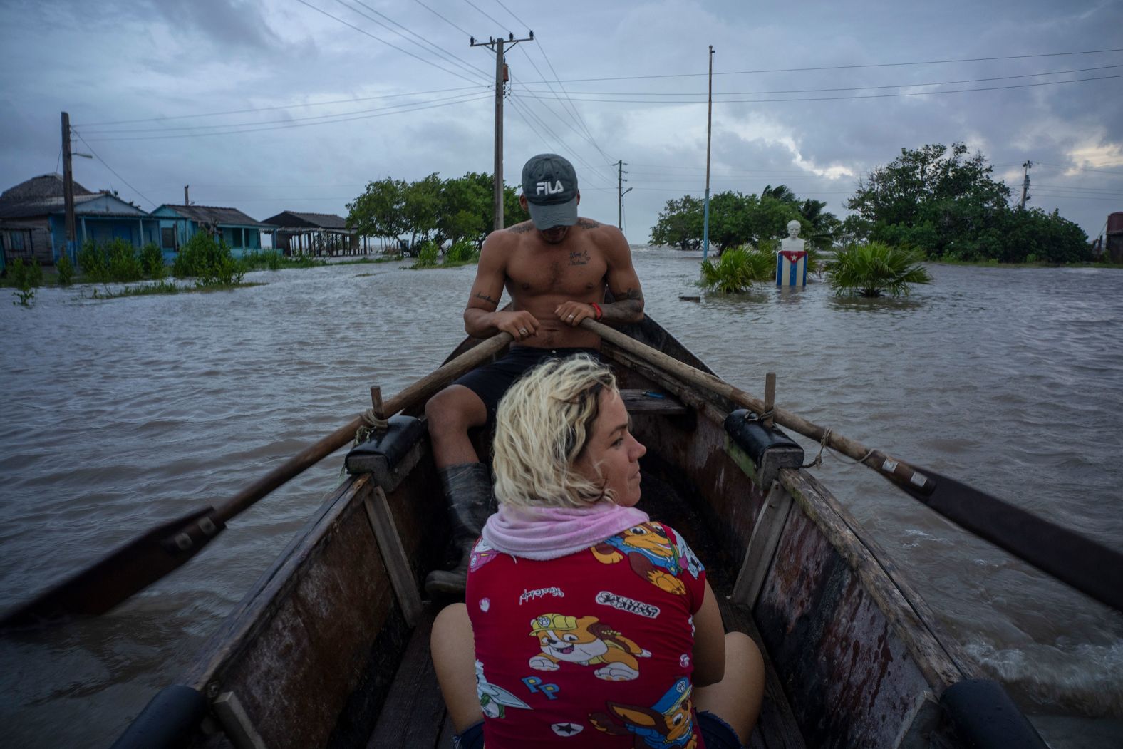People navigate a flooded street in a row boat after Hurricane Helene passed through Guanimar, Cuba, on Wednesday, September 25.