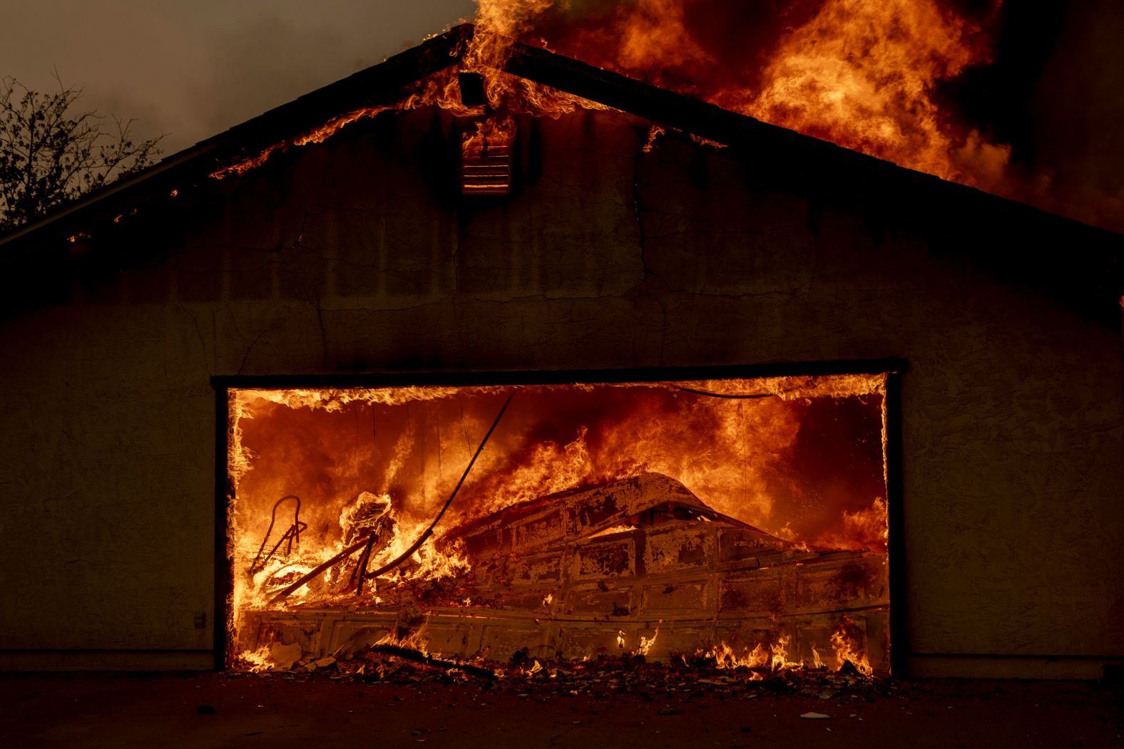 A home in Oroville, California, is engulfed by the <a href="index.php?page=&url=https%3A%2F%2Fwww.cnn.com%2F2024%2F07%2F03%2Fus%2Fthompson-fire-california-heat-wave%2Findex.html">Thompson Fire</a> on Tuesday, July 2.