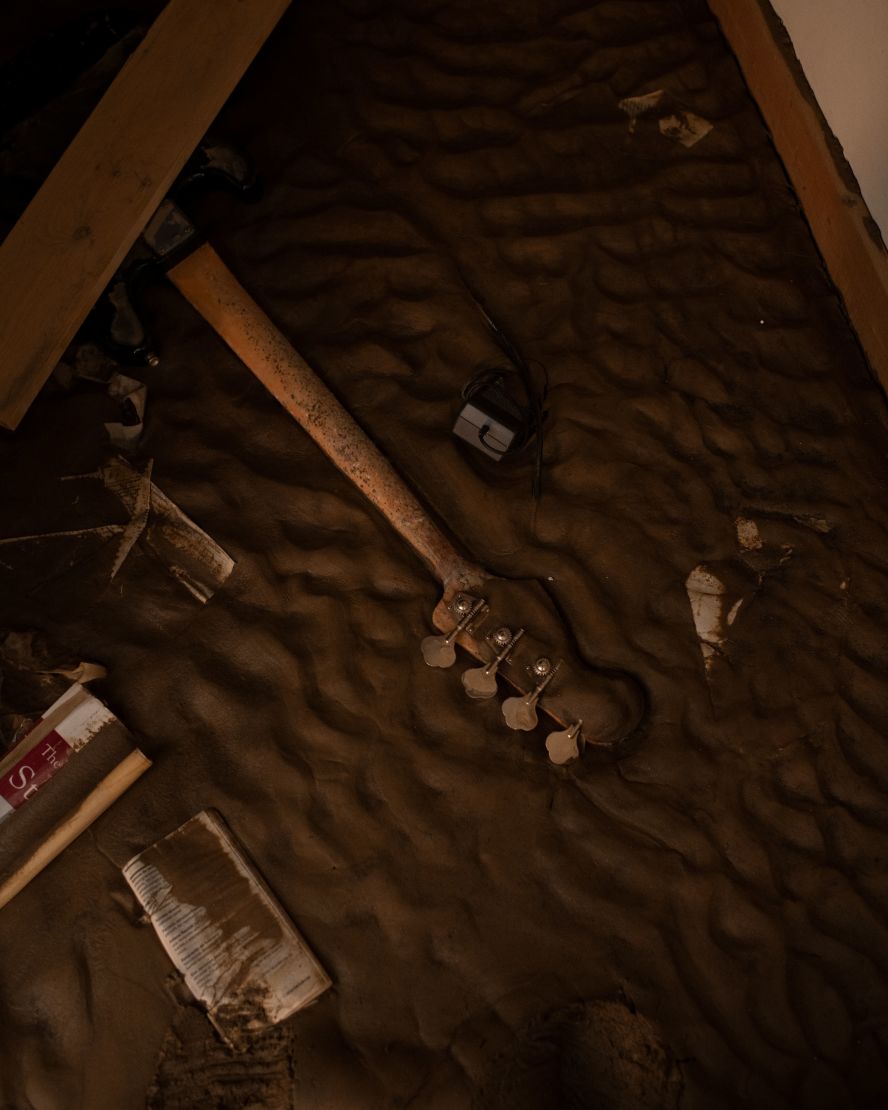 A bass guitar is seen inside the flooded News Record & Sentinel building in Marshall, North Carolina, on Monday, October 7. <a href="index.php?page=&url=https%3A%2F%2Fwww.cnn.com%2F2024%2F10%2F03%2Fweather%2Fhurricane-helene-north-carolina-before-after-images-climate%2Findex.html">Hurricane Helene devastated western North Carolina</a> and left communities there in ruins.