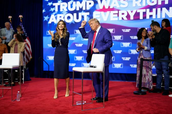 Former President Donald Trump, the Republican Party’s presidential nominee, dances near South Dakota Gov. Kristi Noem at a town hall in Oaks, Pennsylvania, on October 14. Trump ended the town hall early but <a href="https://www.cnn.com/politics/live-news/trump-harris-election-10-14-24#cm29ro58900003b6meq35bigo">stayed on stage for more than 30 minutes as music played</a>, occasionally making brief remarks between songs