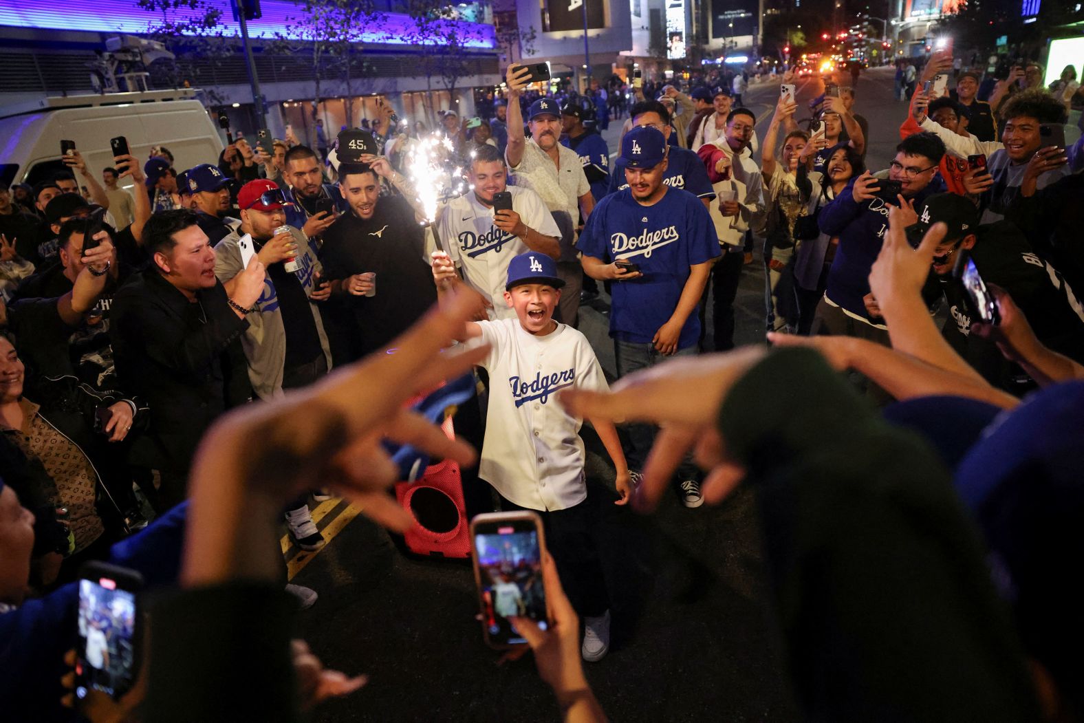 Fans of the Los Angeles Dodgers celebrate in the street after their team defeated the New York Yankees to win the <a href="index.php?page=&url=https%3A%2F%2Fwww.cnn.com%2F2024%2F10%2F25%2Fsport%2Fgallery%2Fworld-series-dodgers-yankees%2Findex.html">World Series</a> on Wednesday, October 30.