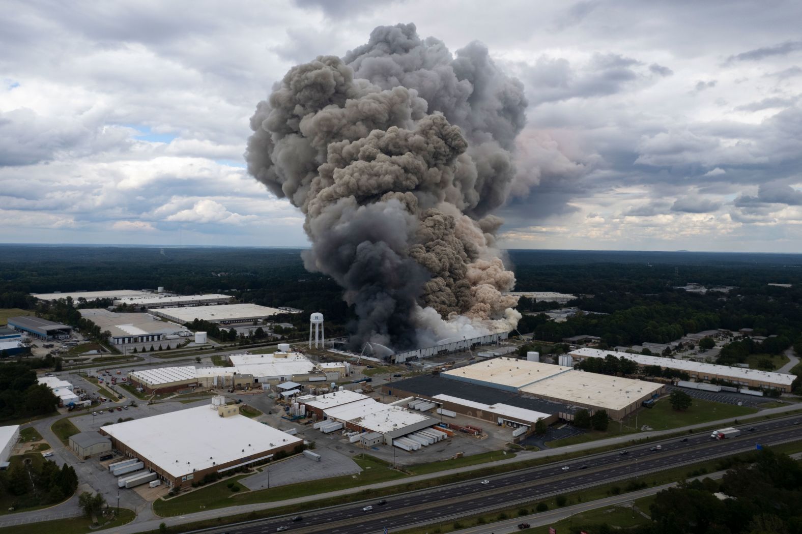 Smoke billows from a fire at the BioLab facility in Conyers, Georgia, on Sunday, September 29. <a href="index.php?page=&url=https%3A%2F%2Fwww.cnn.com%2F2024%2F09%2F29%2Fus%2Frockdale-county-biolab-fire-georgia%2Findex.html">The fire</a> caused a chemical reaction that prompted 17,000 people to evacuate the area around the plant. Air quality surveys conducted by state and federal agencies “revealed the harmful irritant chlorine” coming from the facility, county officials said in a news release Monday morning.