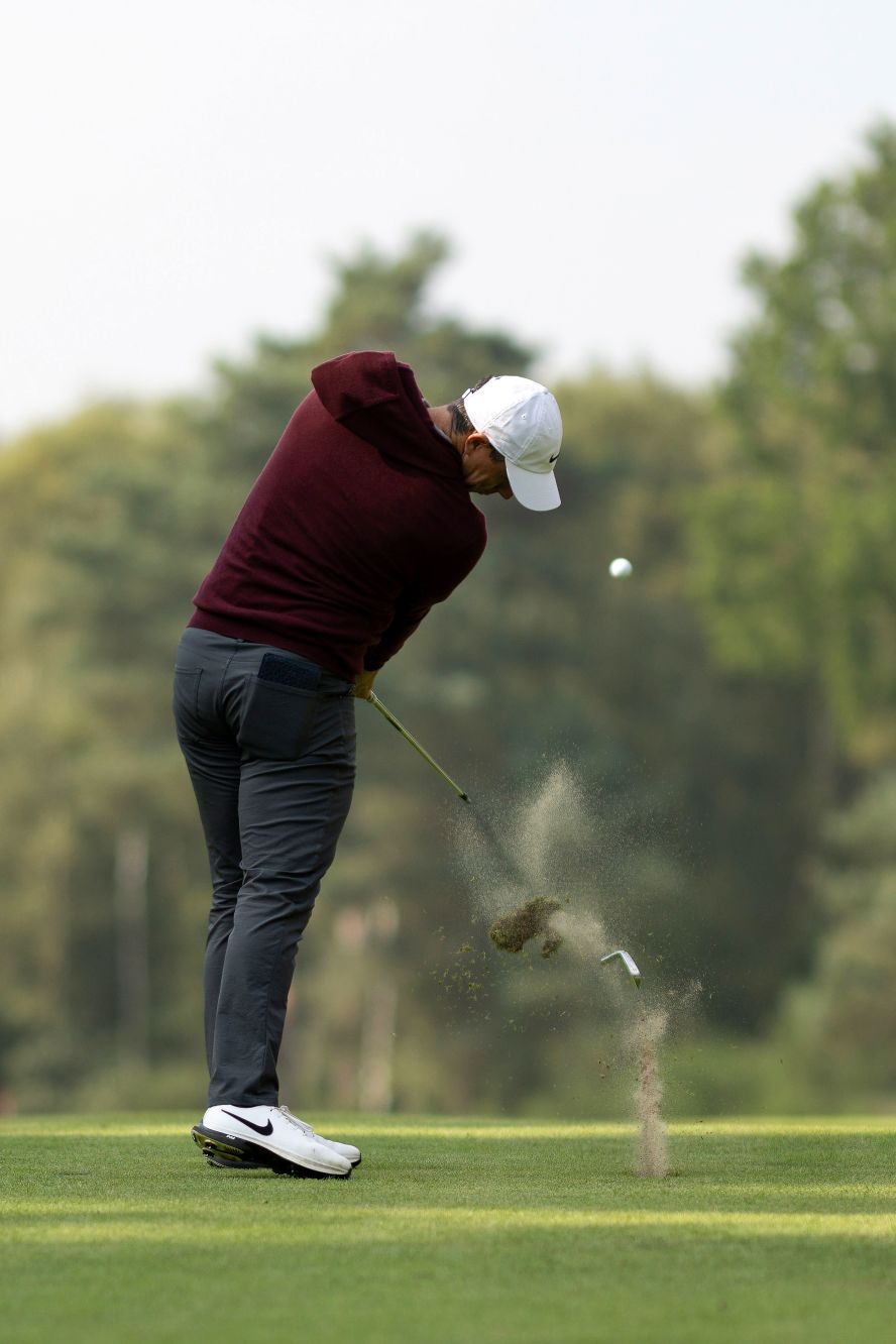The head breaks off the end of Rory McIlroy's 8 iron as he plays an approach shot during the first round of the BMW PGA Championship in Virginia Water, England, on Thursday, September 19.
