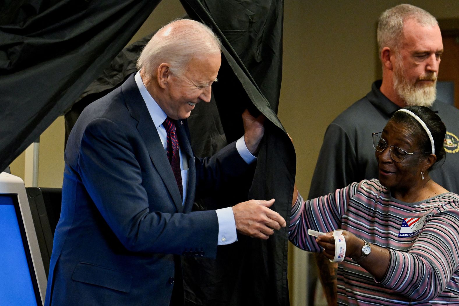 President Joe Biden receives a sticker after <a href="https://www.cnn.com/2024/10/28/politics/joe-biden-vote/index.html">he voted early</a> in New Castle, Delaware, on October 28.