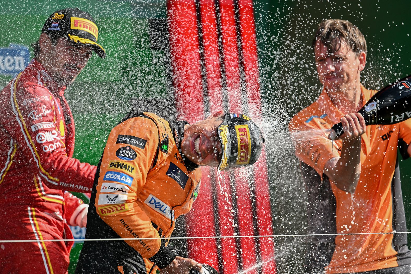 Formula One driver Lando Norris, center, celebrates his Dutch Grand Prix win on the podium in Zandvoort, Netherlands, on Sunday, August 28. <a >Norris produced a dominant performance</a> to potentially reignite the drivers’ world championship with nine races left in the season.