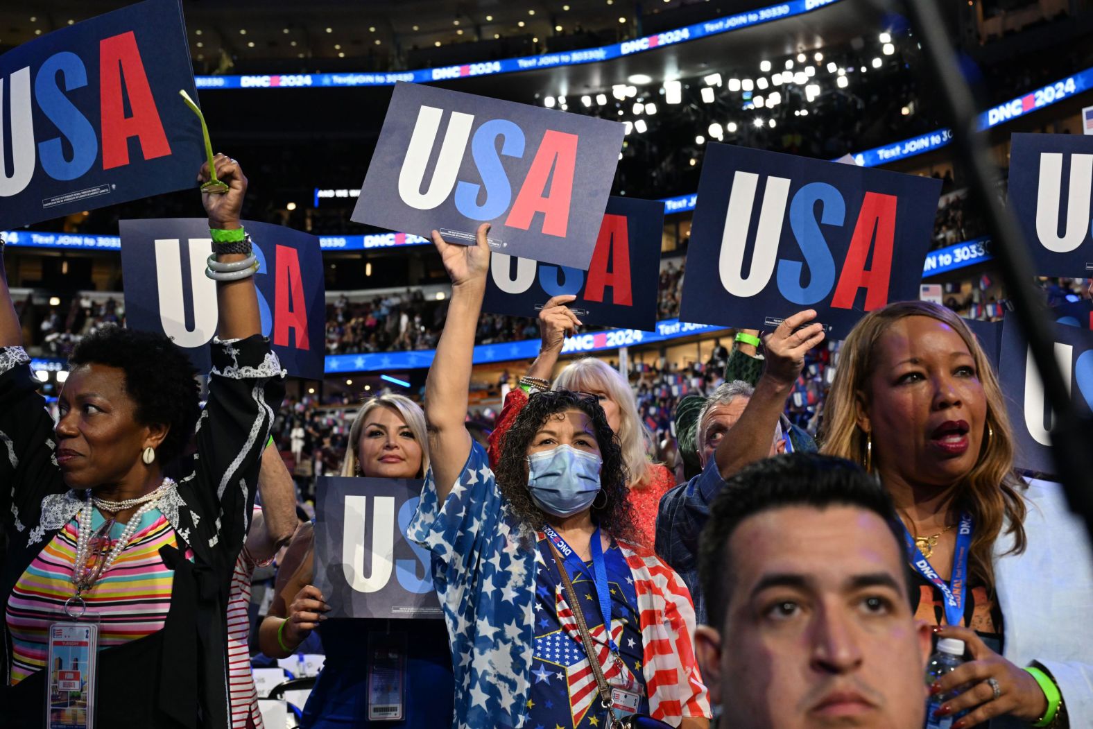 People wave USA signs during the <a >Democratic National Convention</a> on Tuesday, August 20. <a >See last week in 34 photos</a>.