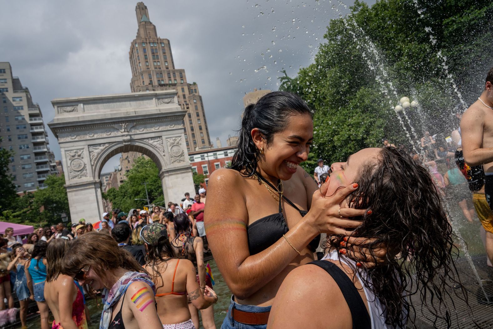 Two people embrace each other in the fountain at Washington Square Park after the New York City Pride March on Sunday, June 30. <a href="index.php?page=&url=https%3A%2F%2Fwww.cnn.com%2F2024%2F06%2F28%2Fworld%2Fgallery%2Fthe-week-in-38-photos%2Findex.html">See last week in 38 photos</a>.