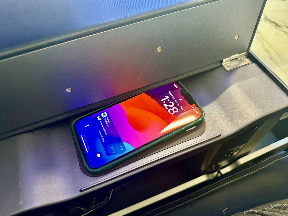 A photo of the wireless charging pad on United's A321neo first class seat