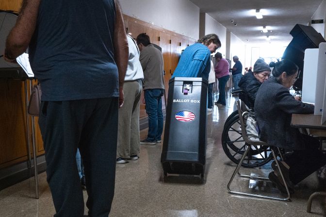 Residents vote at an in-person early voting location in the Kenosha Municipal Building on October 24 in Kenosha, Wisconsin.