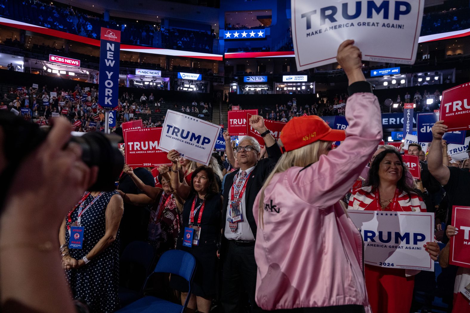 Delegates from New York cheer during the convention on Monday.