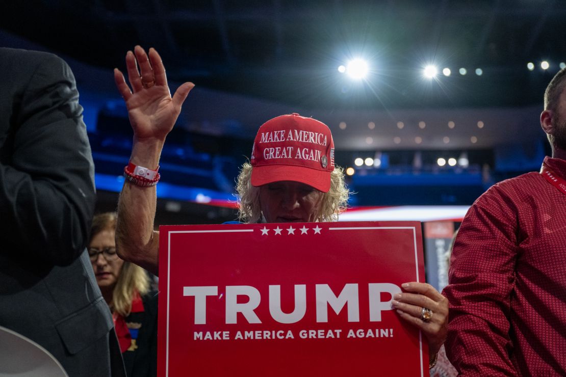 Nebraska delegates pray at the end of day two of the 2024 Republican National Convention hosted at the Fiserv Forum in Milwaukee, Wisconsin, on July 16, 2024.