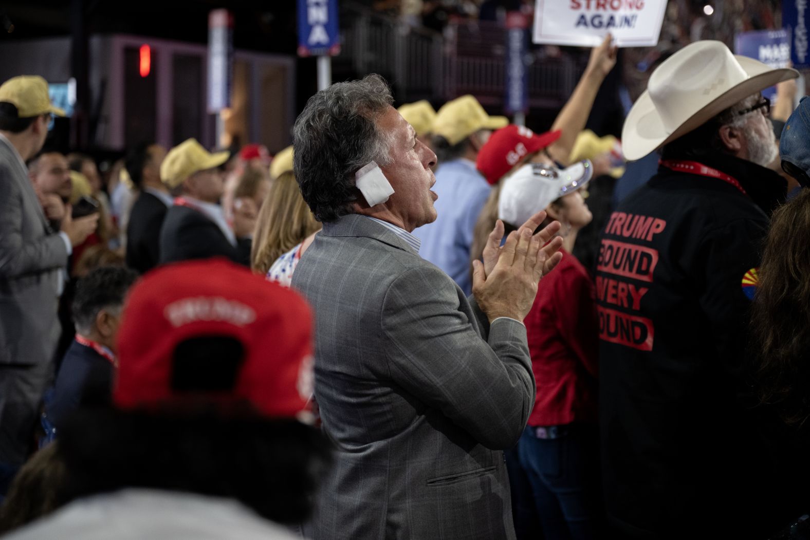 This delegate was <a >one of many attendees who were wearing a bandage on their ear</a> to show solidarity with Trump.