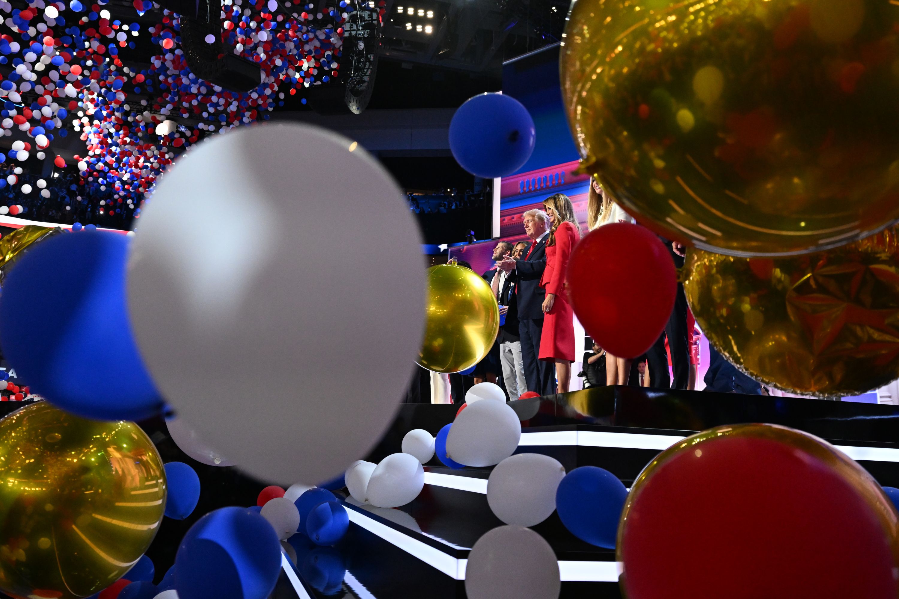 Balloons fall around former President Donald Trump and his family after his speech at the Republican National Convention on Thursday, July 18.