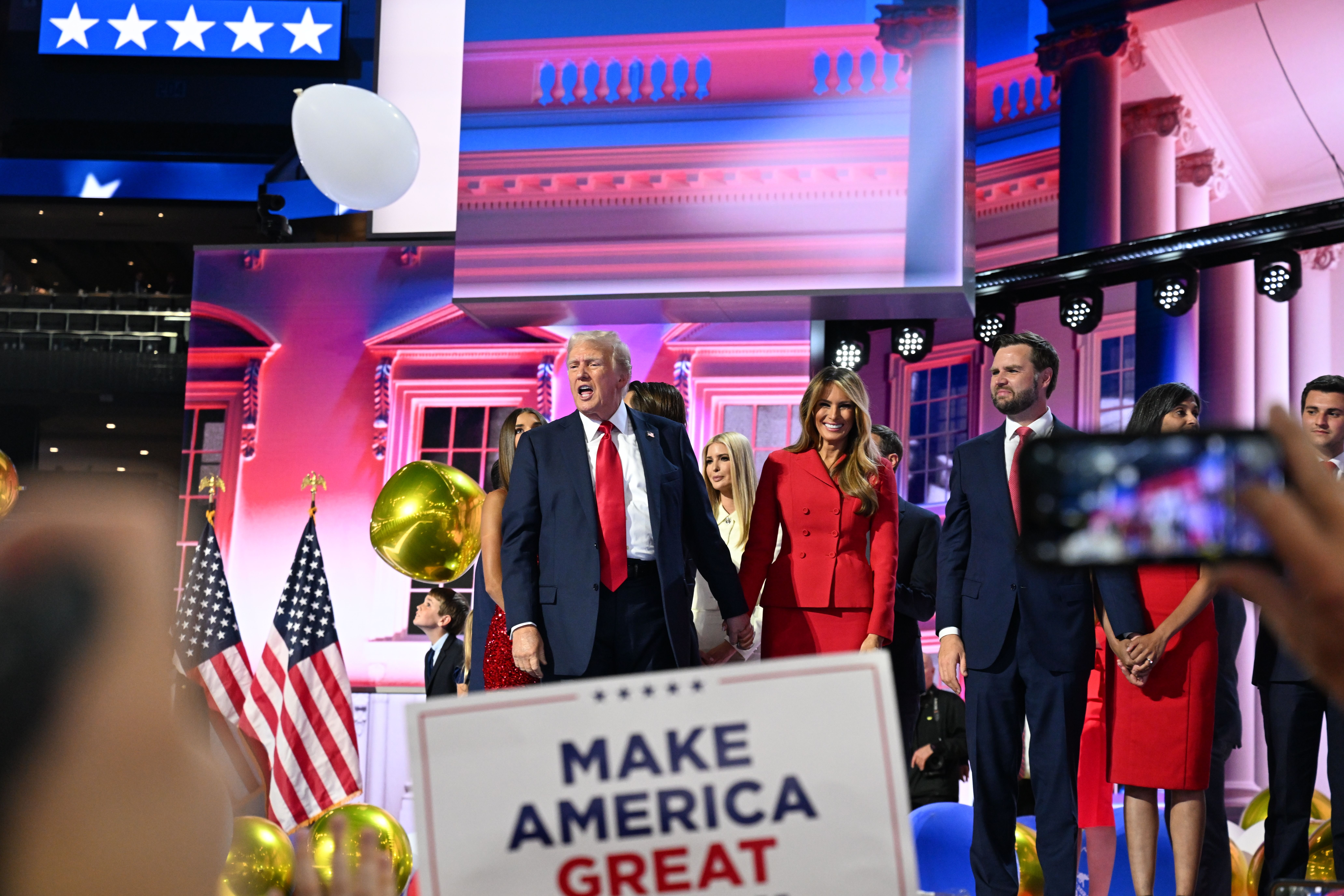 Former US President Donald Trump and former first lady Melania Trump are joined on stage by vice presidential nominee JD Vance and his wife, Usha, at the end of the <a href="https://www.cnn.com/2024/07/15/politics/gallery/republican-national-convention/index.html">Republican National Convention</a> in Milwaukee on Thursday, July 18. Trump had just given his first speech since surviving Saturday's assassination attempt in Butler, Pennsylvania.