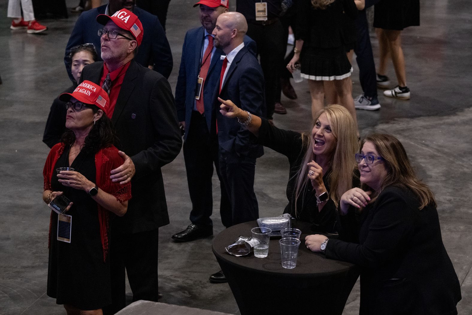 Trump supporters cheer as results come in at his election night watch party in West Palm Beach.