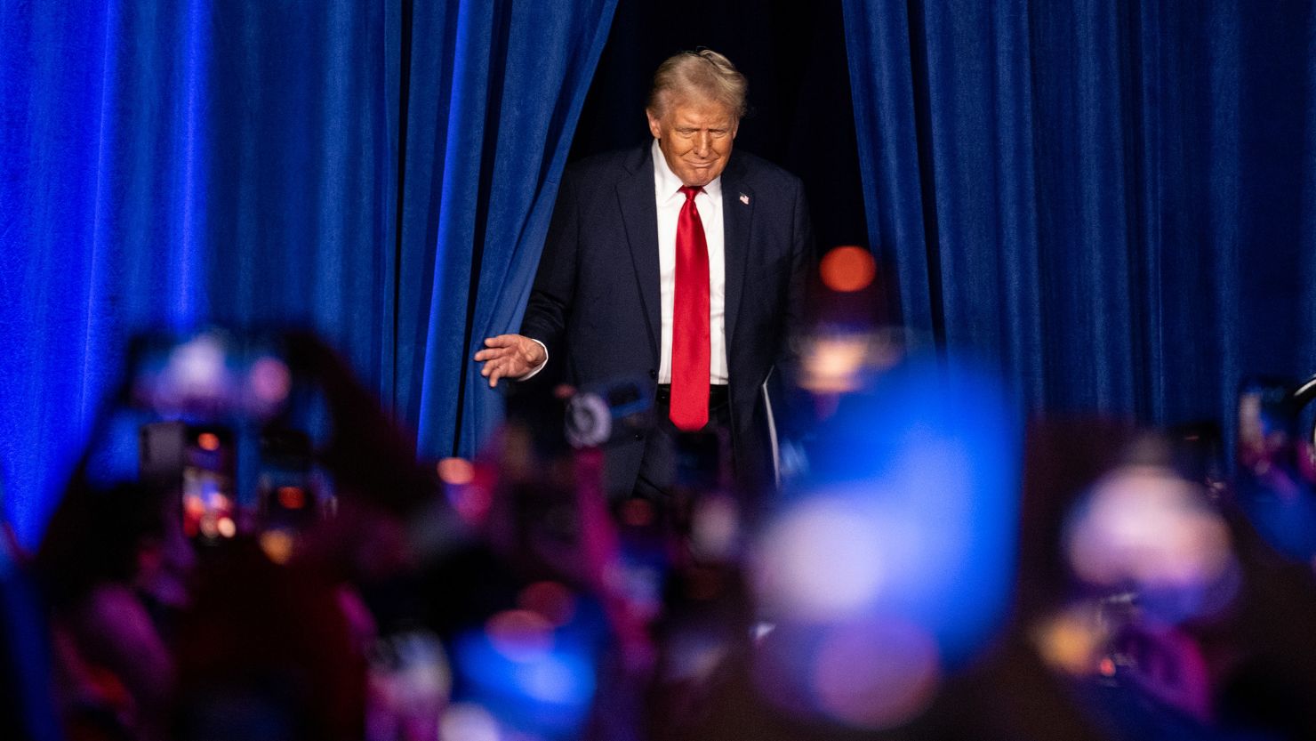 Former President Donald Trump emerges to speak at the Palm Beach County Convention Center in West Palm Beach, Florida, on Wednesday, November 6, 2024.
