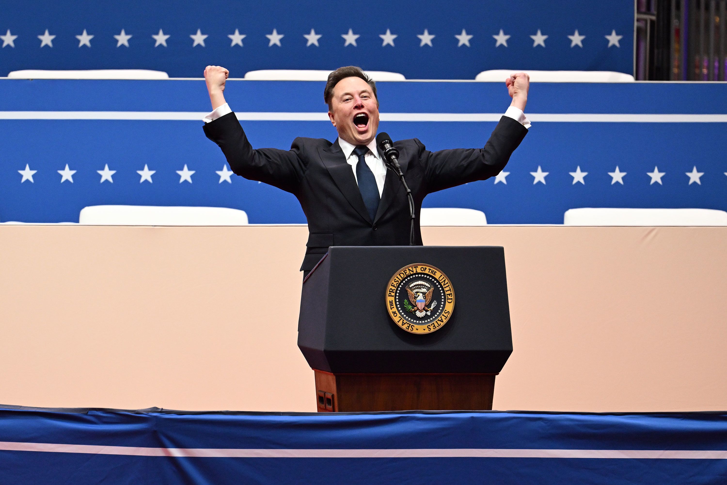 Elon Musk speaks at Capital One Arena on Monday.