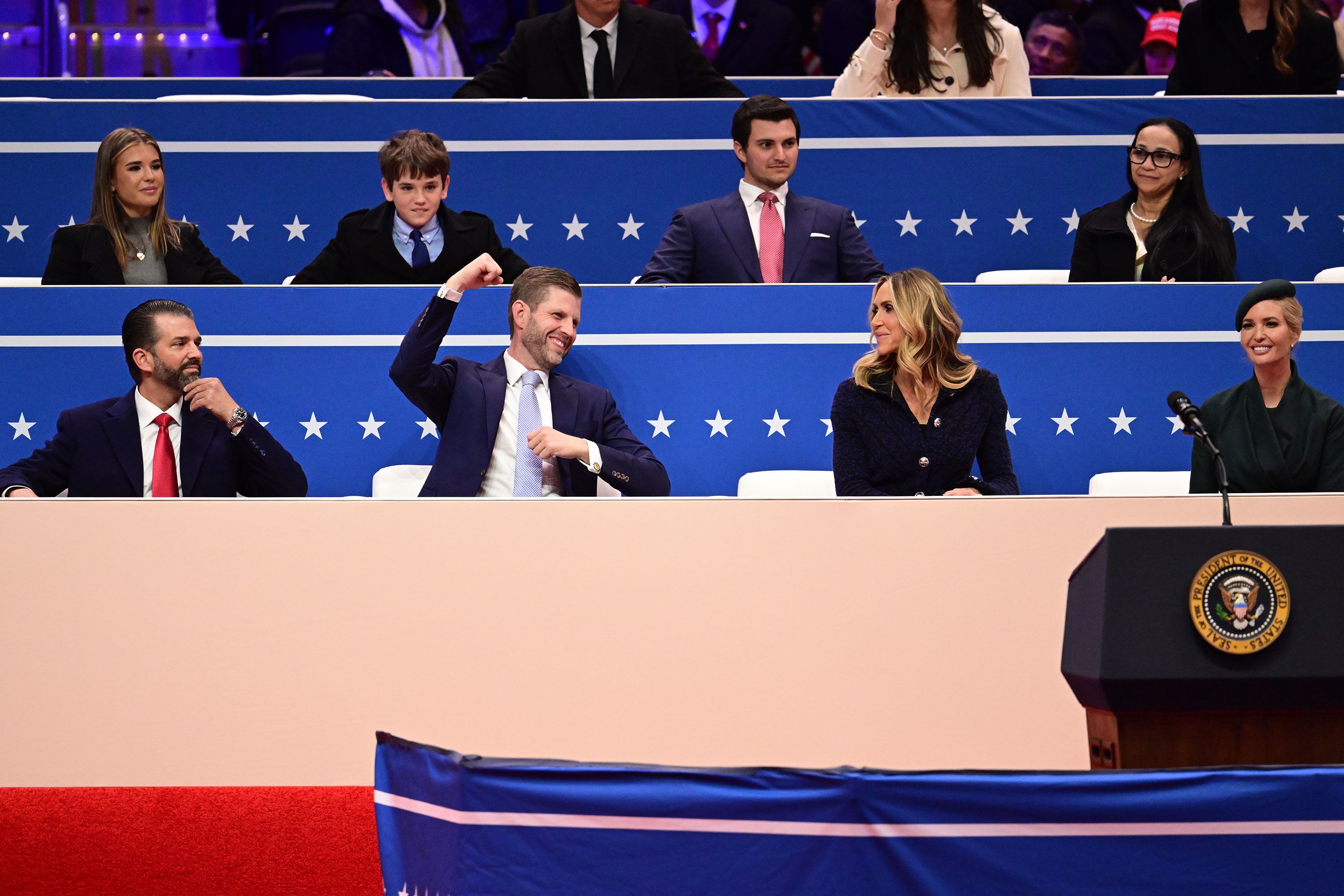 Donald Trump Jr., Eric Trump, Lara Trump and Ivanka Trump take their seats in Capital One Arena on Monday.