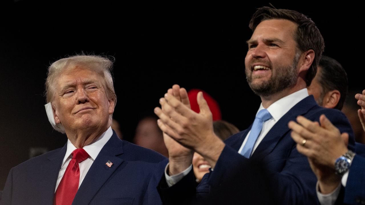 Former President Donald Trump looks at his running mate, Ohio Sen. JD Vance, at the Republican National Convention in Milwaukee on July 15, 2024.