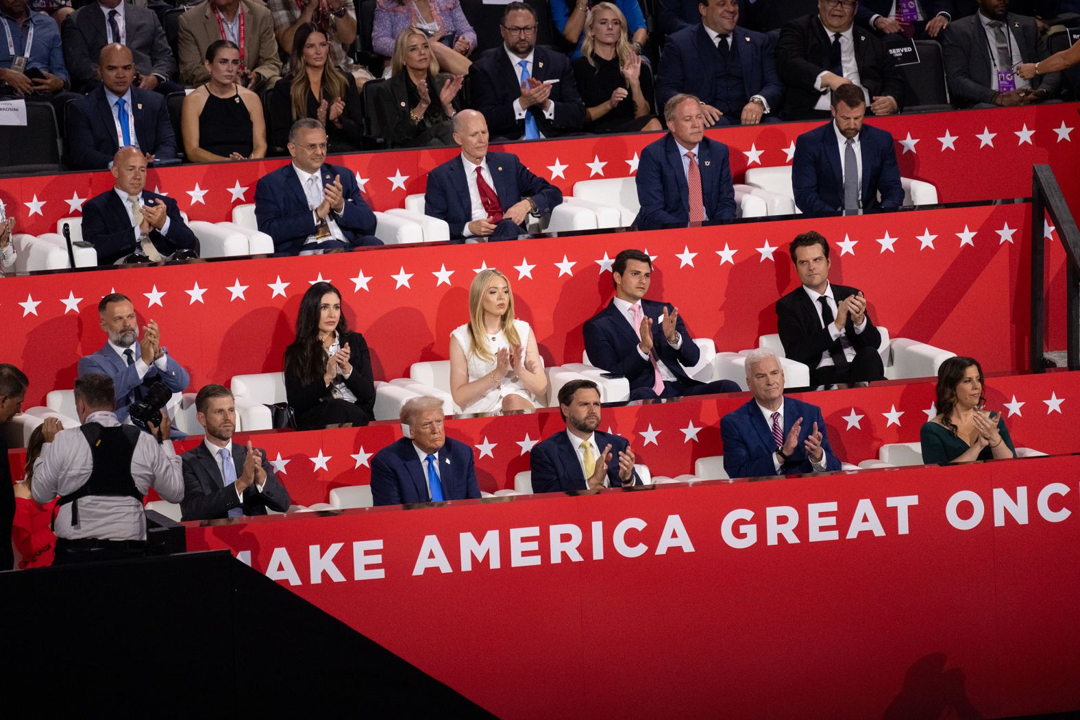 Trump, on the bottom row second from left, watches the convention next to his son Eric and Vance on Tuesday.